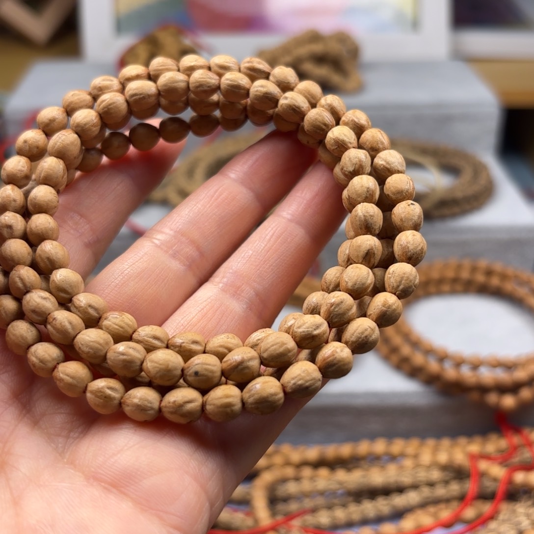 冬***冬柏香籽/百香籽吊坠原桩红牙