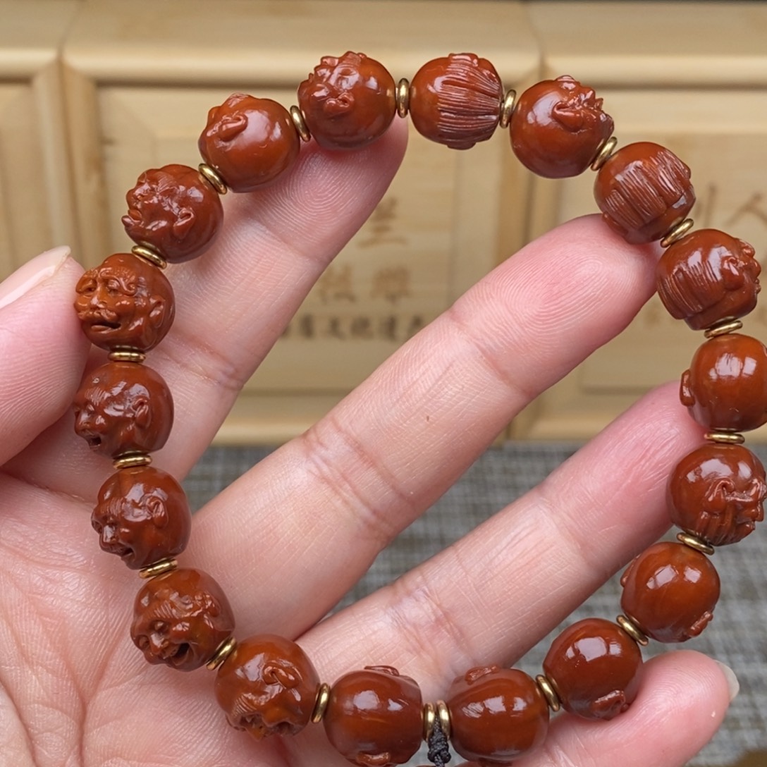 石***司橄榄核吊坠十八罗汉