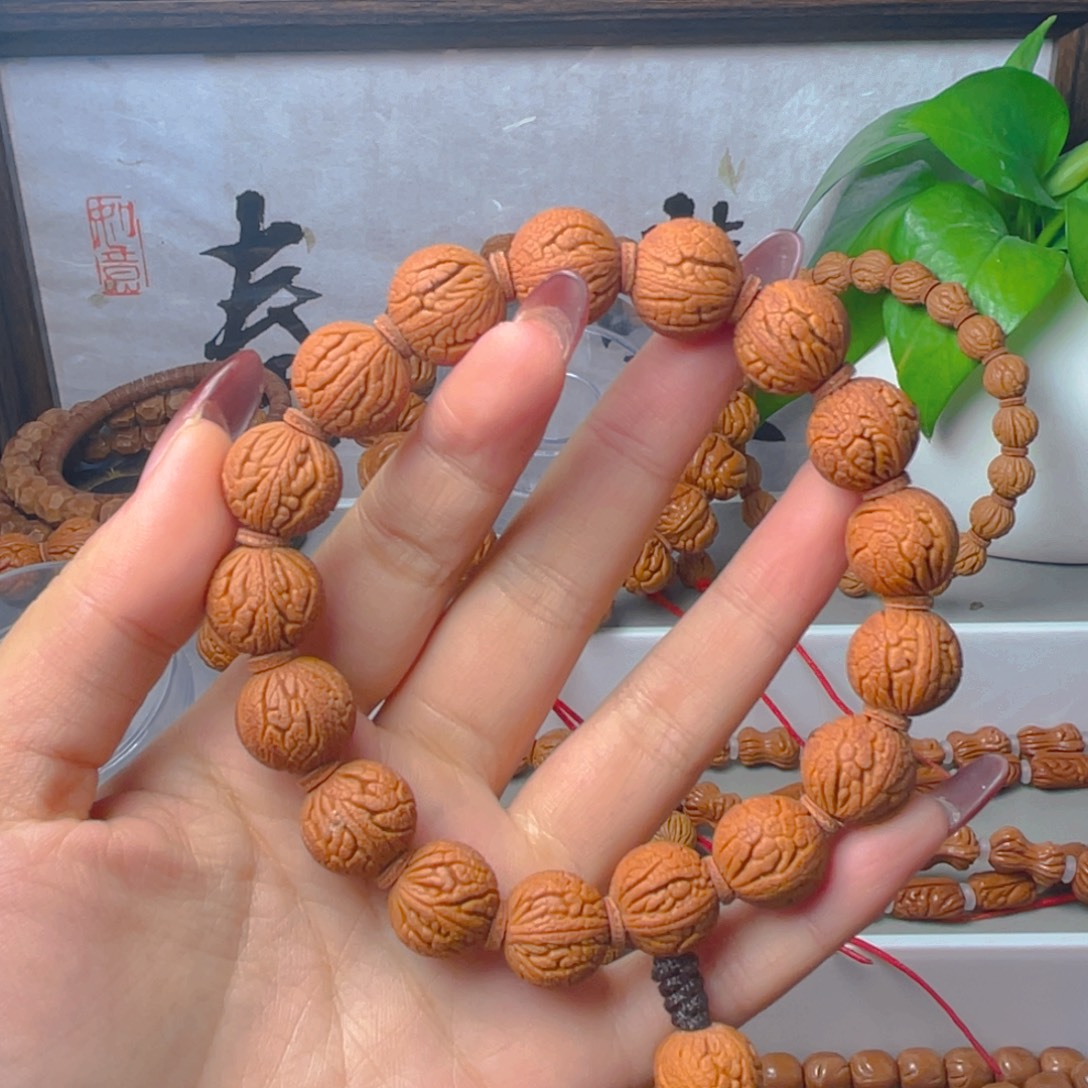 阿***彡秦岭龙纹桃核手串