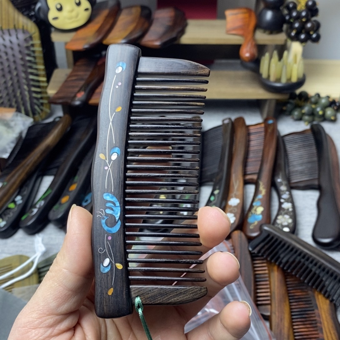 阳***滴东非黑黄檀（紫光檀）梳子