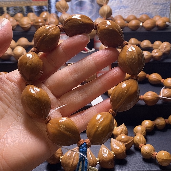 听***雨橄榄核手串三花精抛21×29