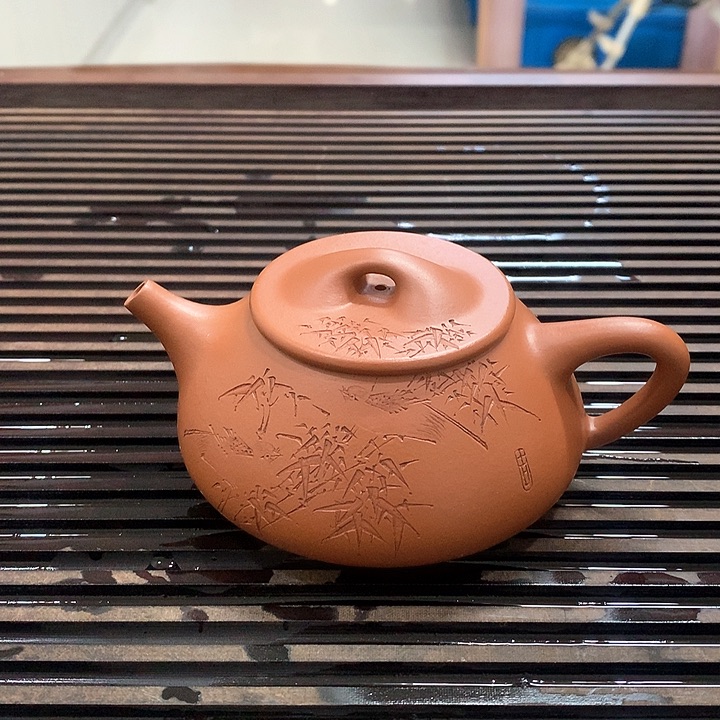 紫砂茶壶告****她朱泥刻绘石瓢