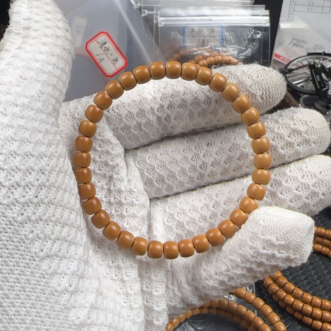 橄榄核吊坠沈***忙6.4mm清水极限弧单圈