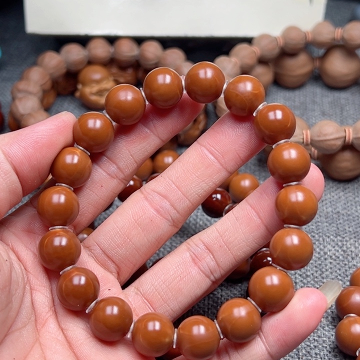 奔***牛手串橄榄核1.2全品小孔