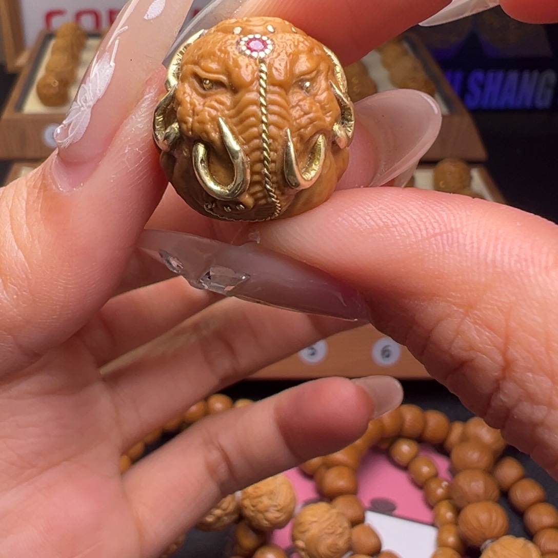 文玩核桃把件镶嵌款火焰象神18左右尺寸全品有正常封口线