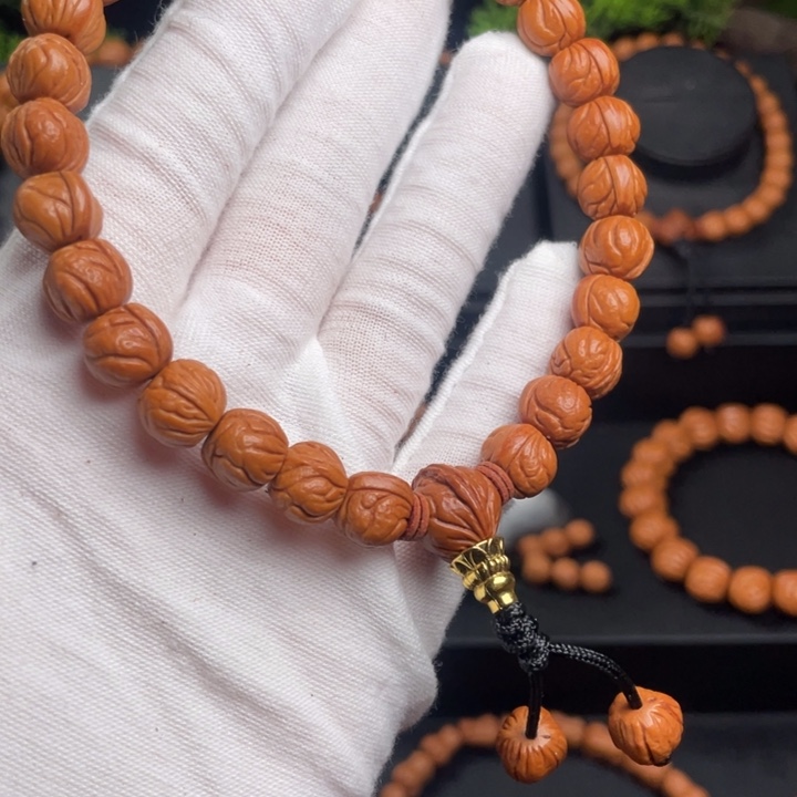 姬***界木质类精品桃核手持