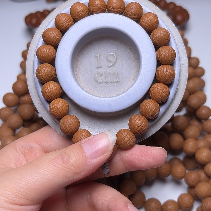 红***白吊坠猴头核桃12+同尺凤羽手持