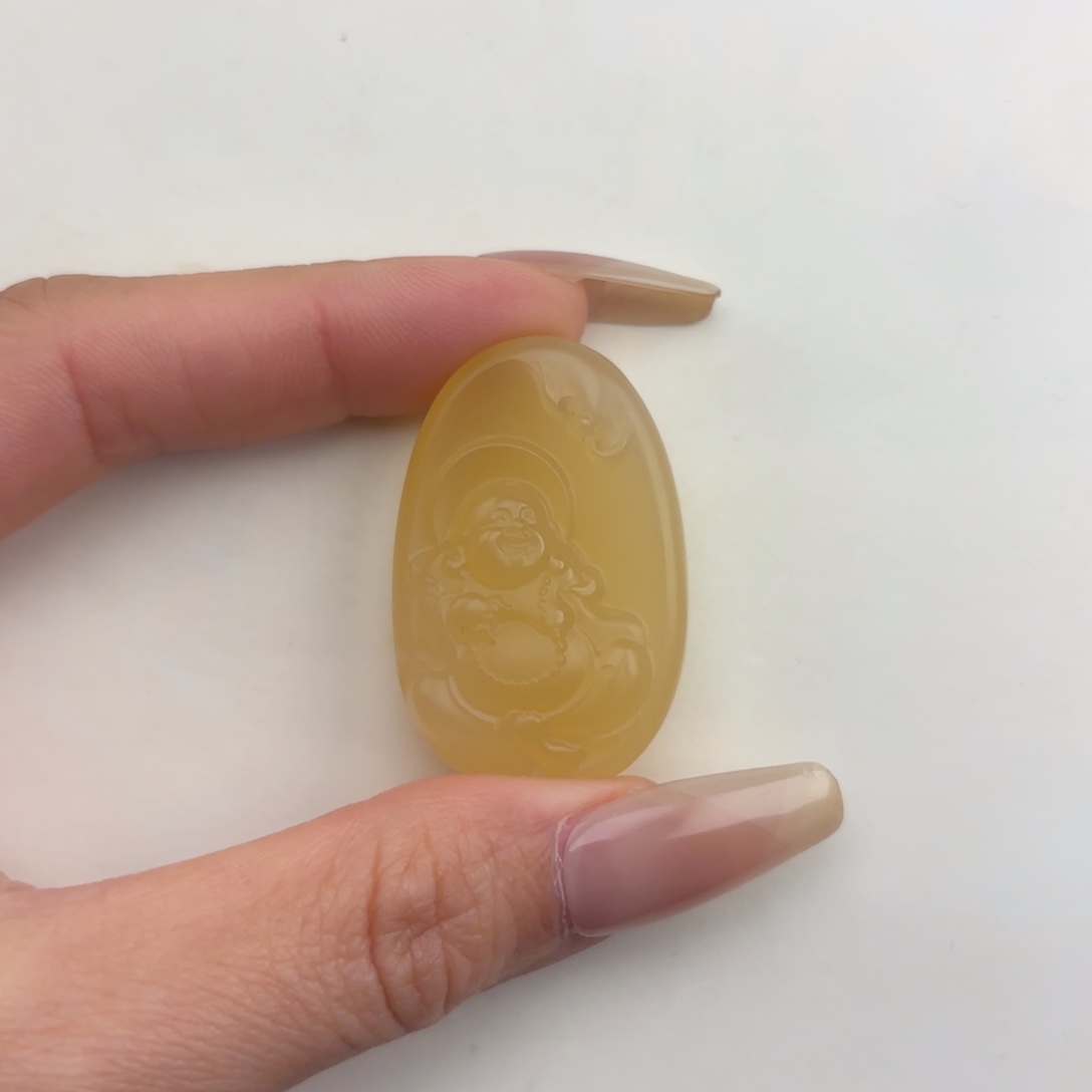 谁***裤石英质玉未镶嵌黄蜡石挂件