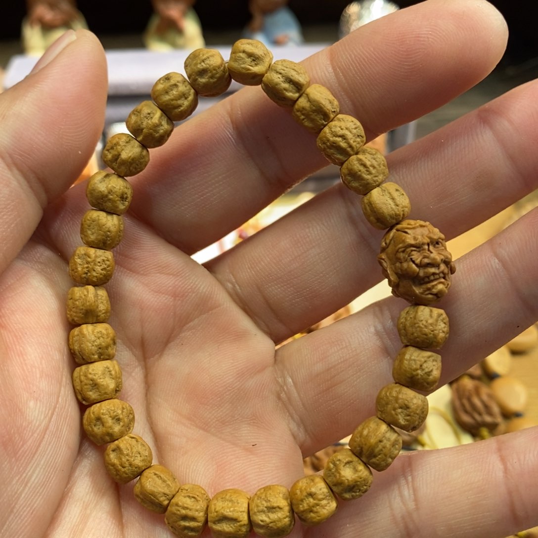 潍坊核雕桃核雕刻罗汉头串