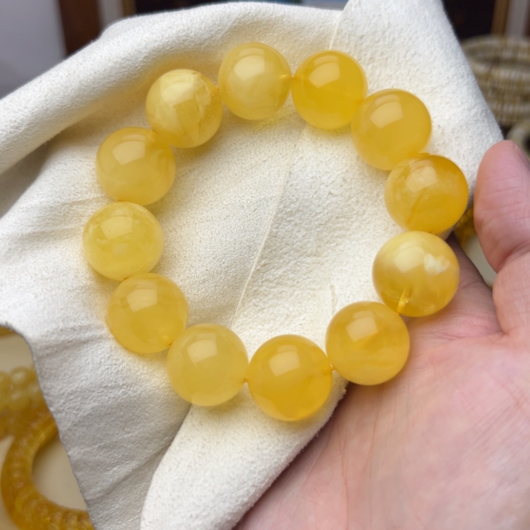 琥珀裸石未镶嵌齐**。19圆珠