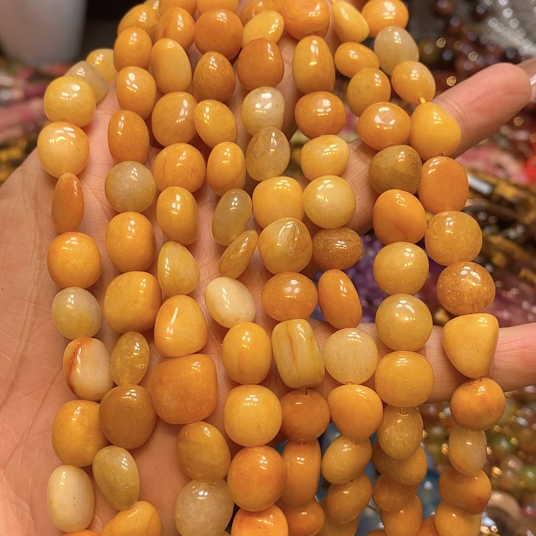 玛瑙/玉髓未镶嵌珠宝半成品天然黄玉糖豆一条