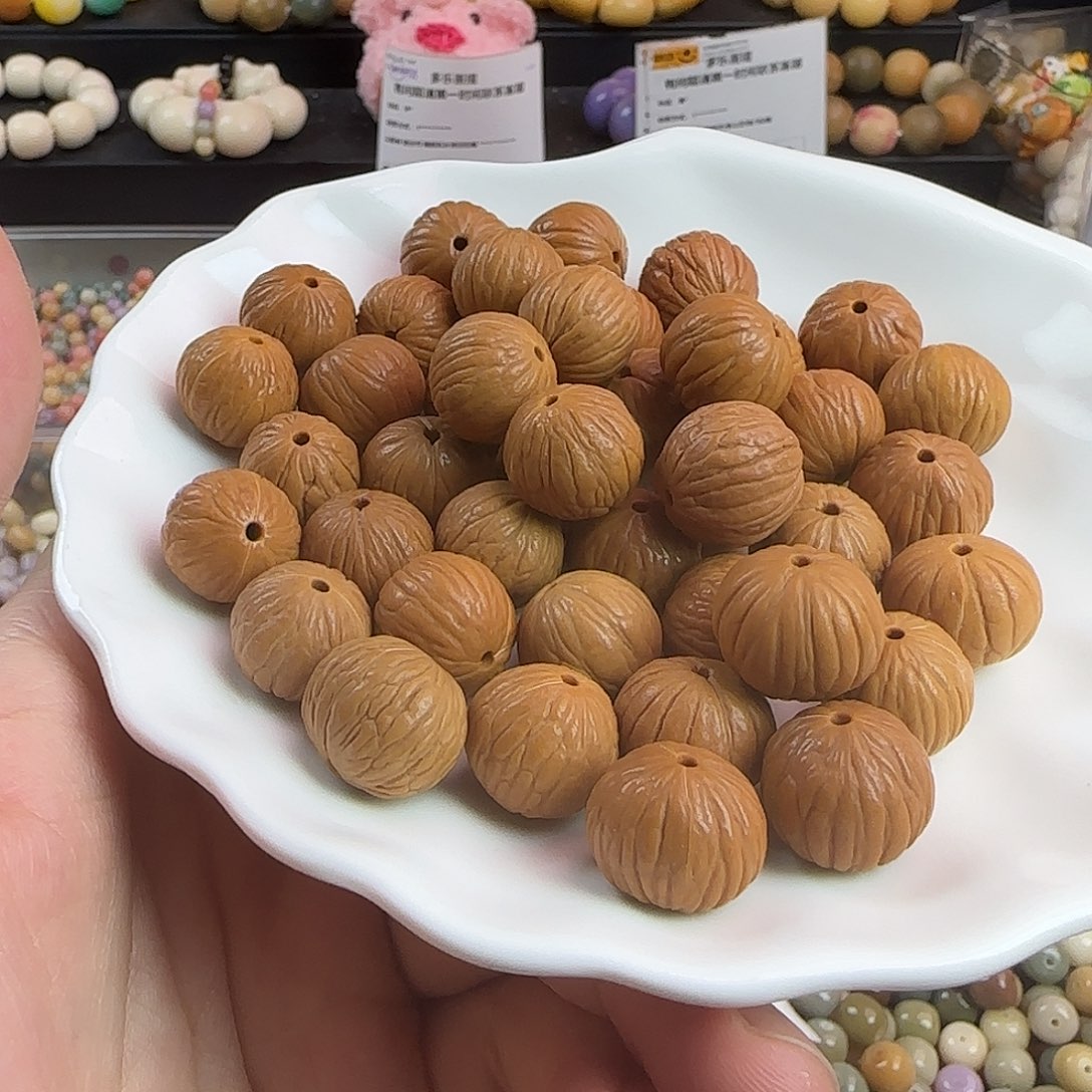 菩提根/象牙果手串微瑕卡16+猴头凤羽100颗