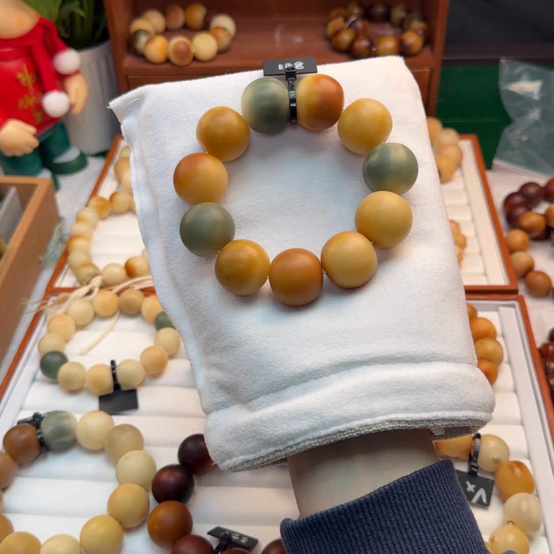 菩提根/象牙果手串卡24.5干磨中瑕疵多宝色