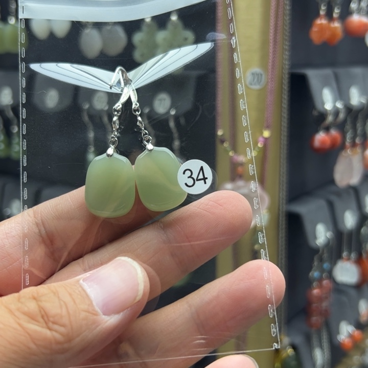 渡***鸟银S925镶嵌和田玉耳饰