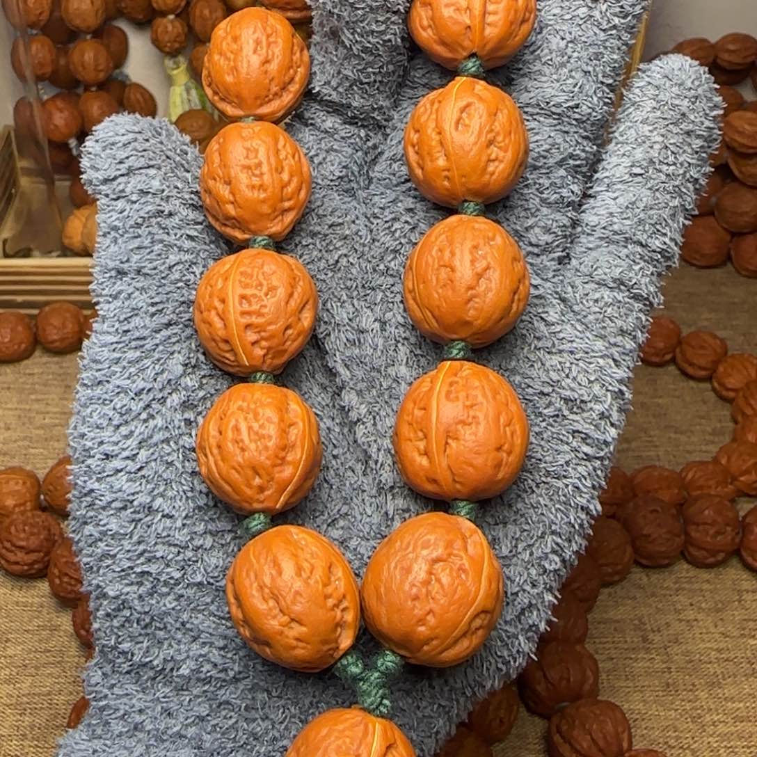 文玩核桃吊坠红皮钱袋子手持21.22.22