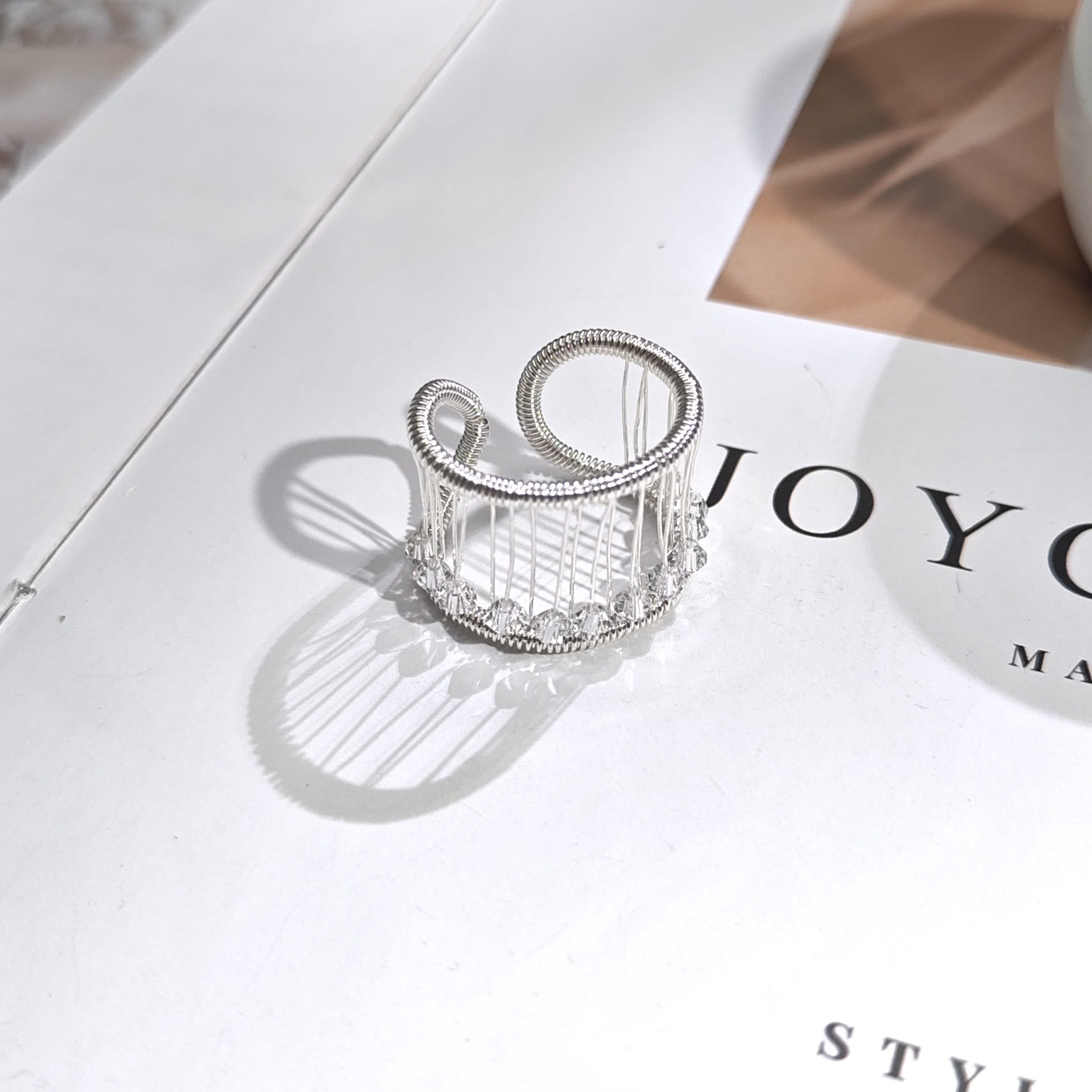 铜合金仿水晶戒指 05637时尚气质镂空设计感绕线串珠算盘戒指