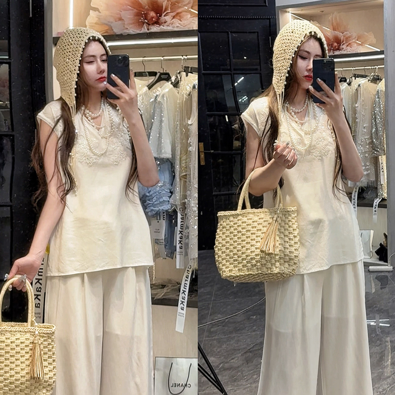 【白玉兰山】 62642重工串珠花朵开叉前短后长棉麻马甲