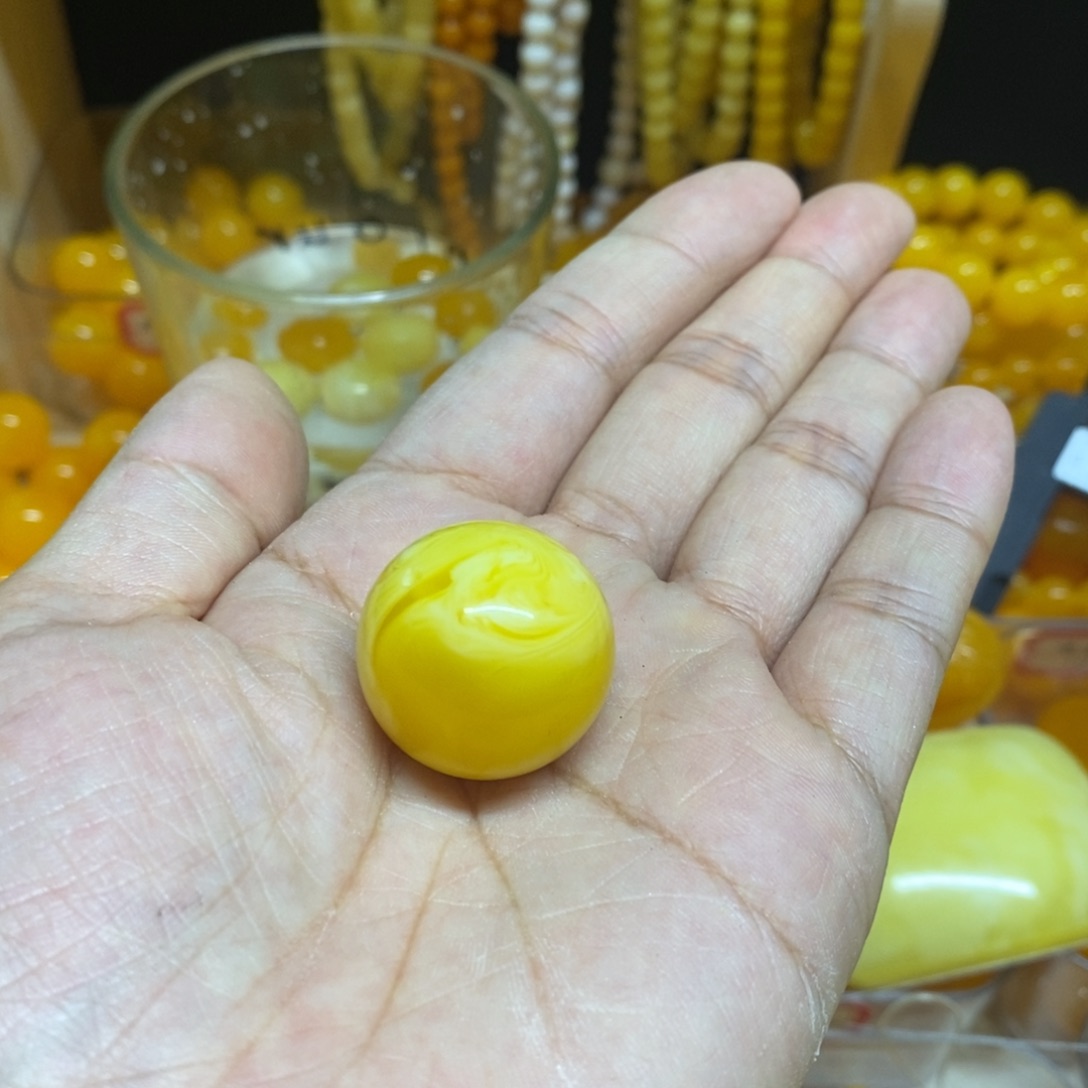 宁***远大理石磁石全品无暇单珠25鸡油黄