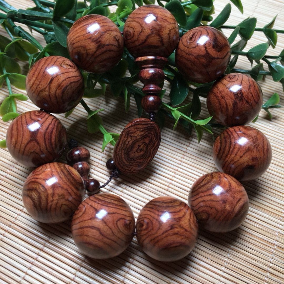 海南黄花梨2.2老料糠梨对眼鬼脸纹包含配饰52克