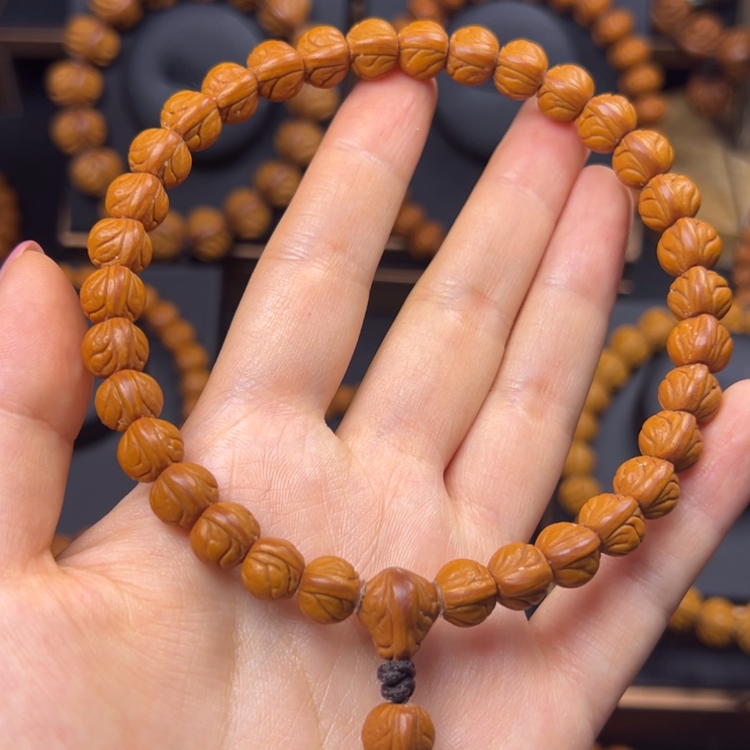 王***'桃核手串野生玉龙脊0.9