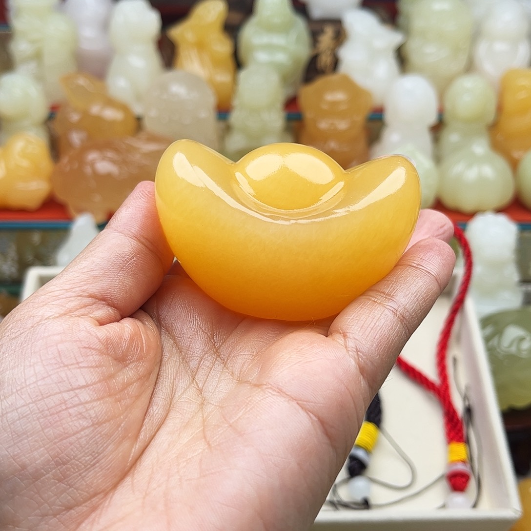 沧***）石材元宝手把摆件