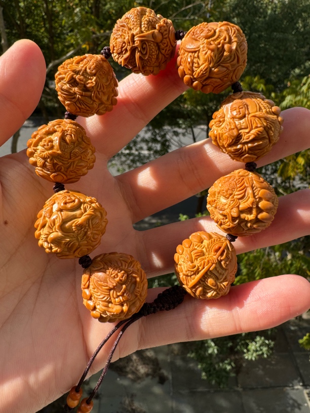 橄榄核核雕尺寸24九龙万佛手工文玩手串手持挂件精品核雕核质红润