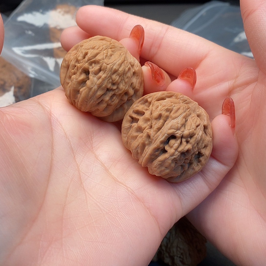 桃核把件放漏四座楼