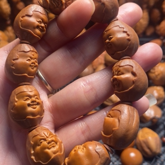 橄榄核吊坠包衣百态