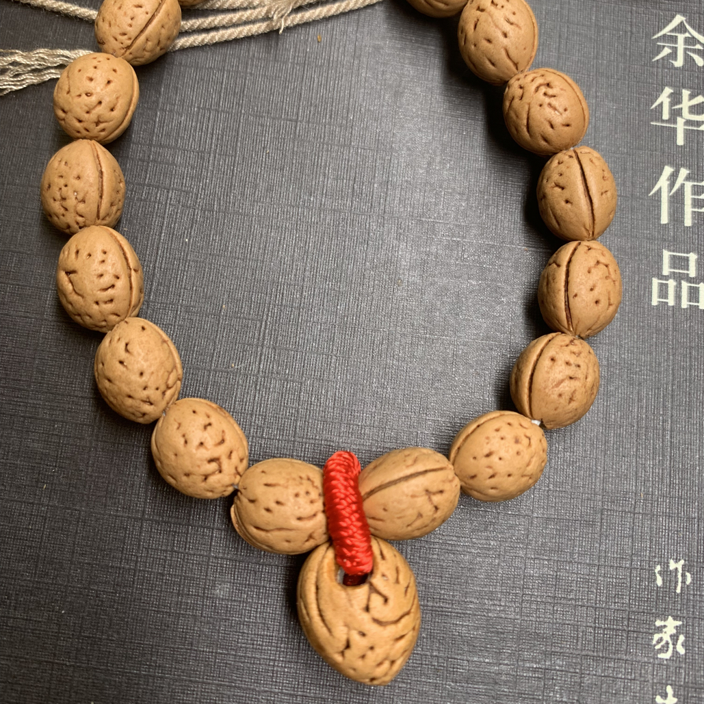 野生脑纹钱袋子卡0.9手串桃核手串