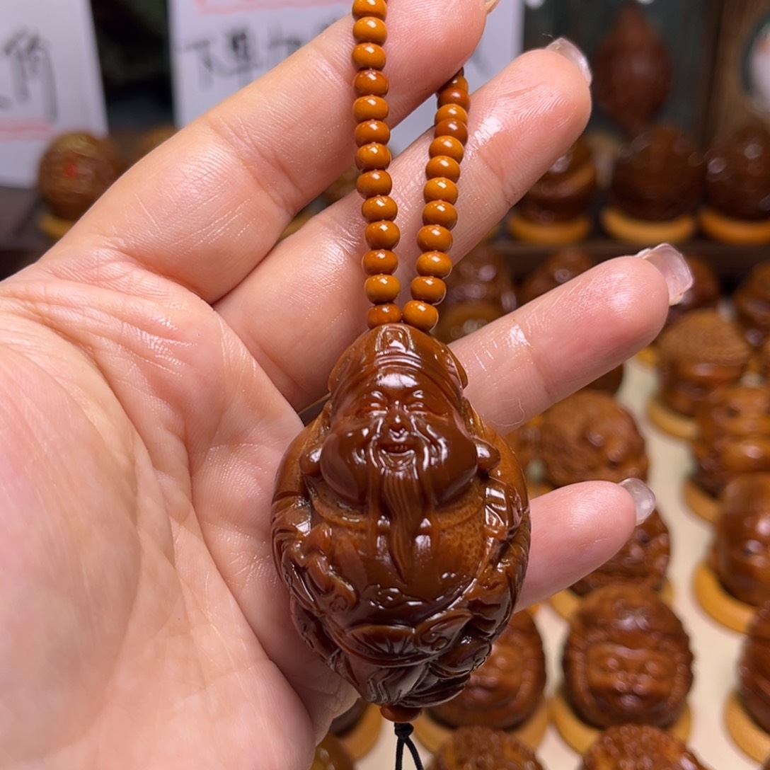 橄榄核把件玉化祥云财神手把