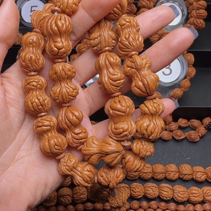 鲁***湘手串桃核花生手持