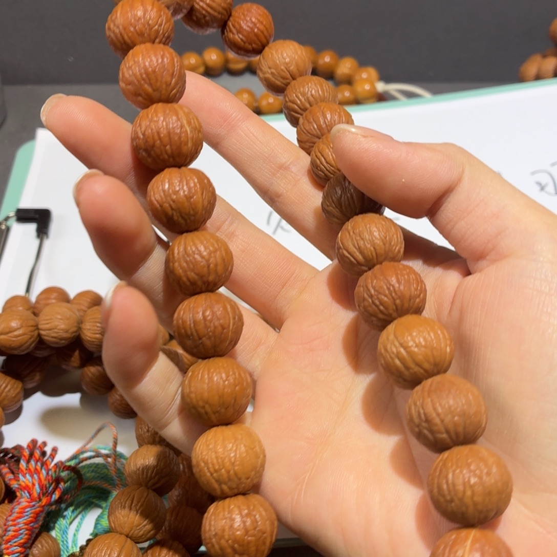 5***5吊坠桃核全品凤羽手持