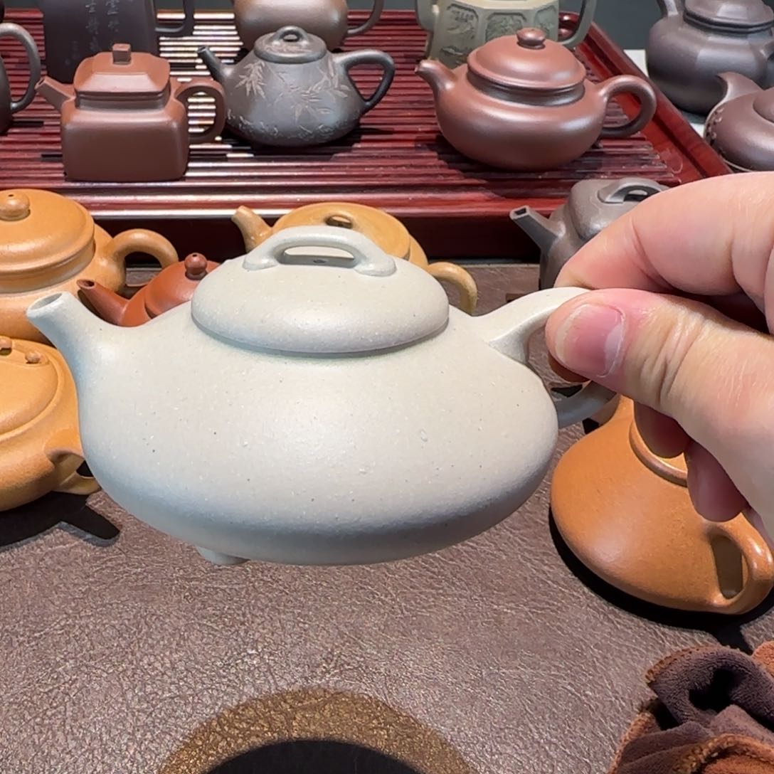 紫砂茶壶做***点定窑白乳瓢