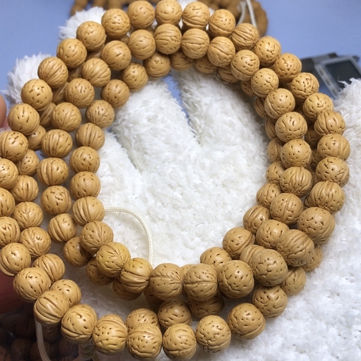 绅***氓吊坠桃核野生全品奶油皮脖挂