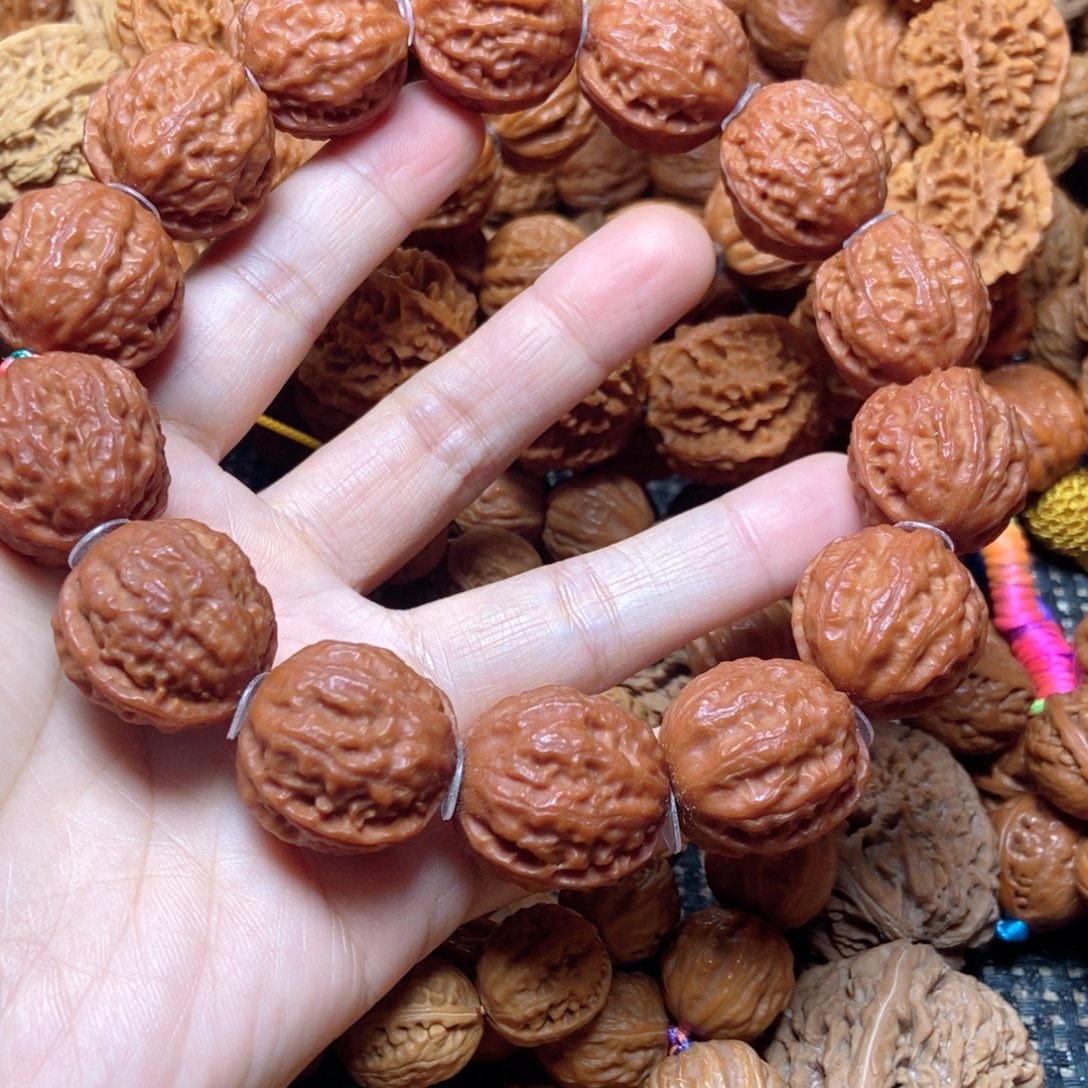 和***丶桃核吊坠荔枝纹手串
