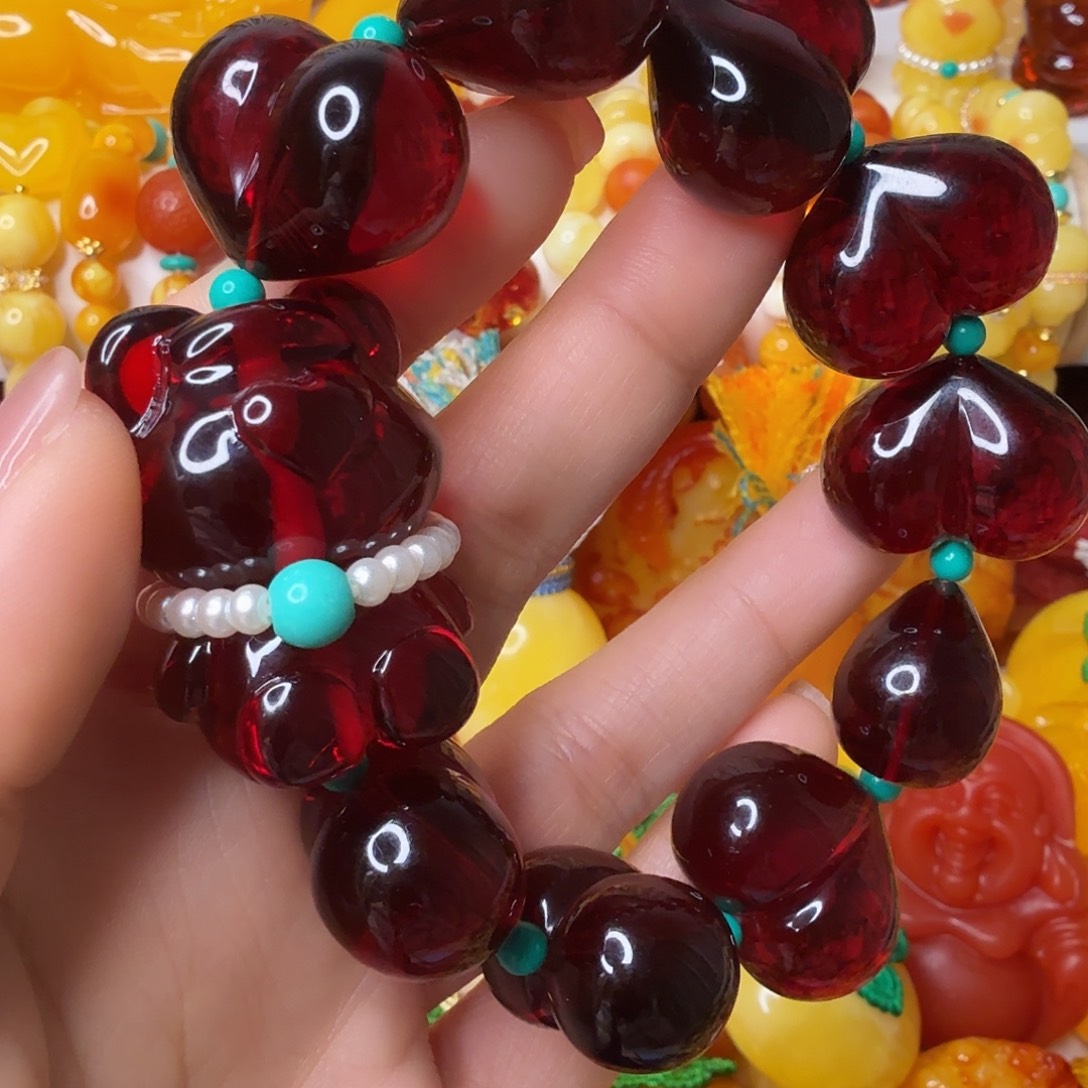 怡***琶非金属屁桃小熊手串