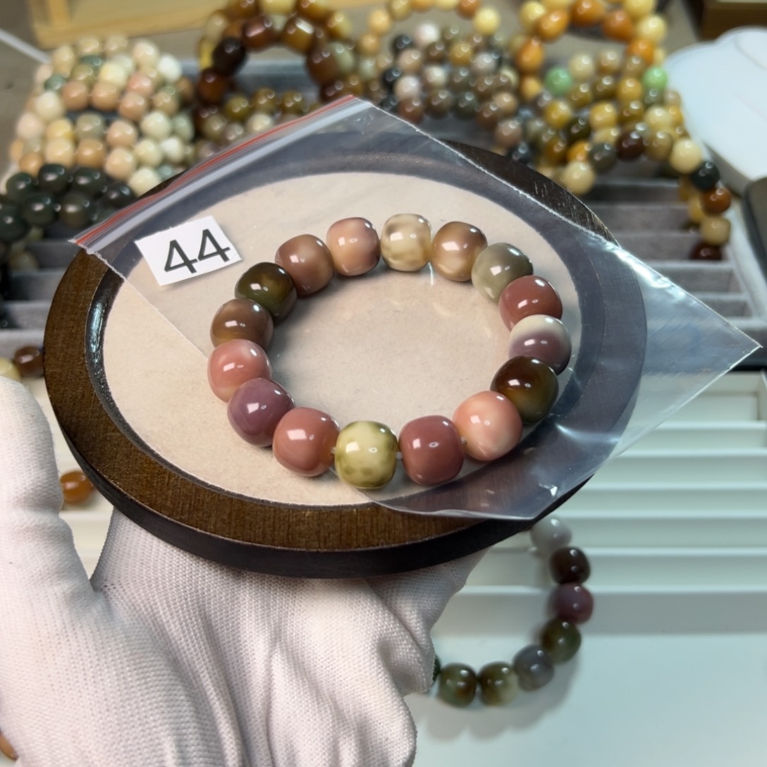 仰***雪手串菩提根/象牙果44号紫藤乐园桶珠卡14.7  可能有色差