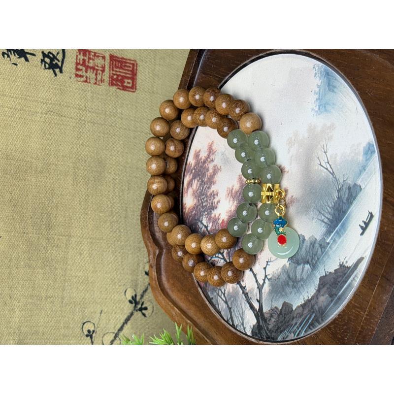 DA1136-0.6金丝楠木带绿琉璃平安扣
