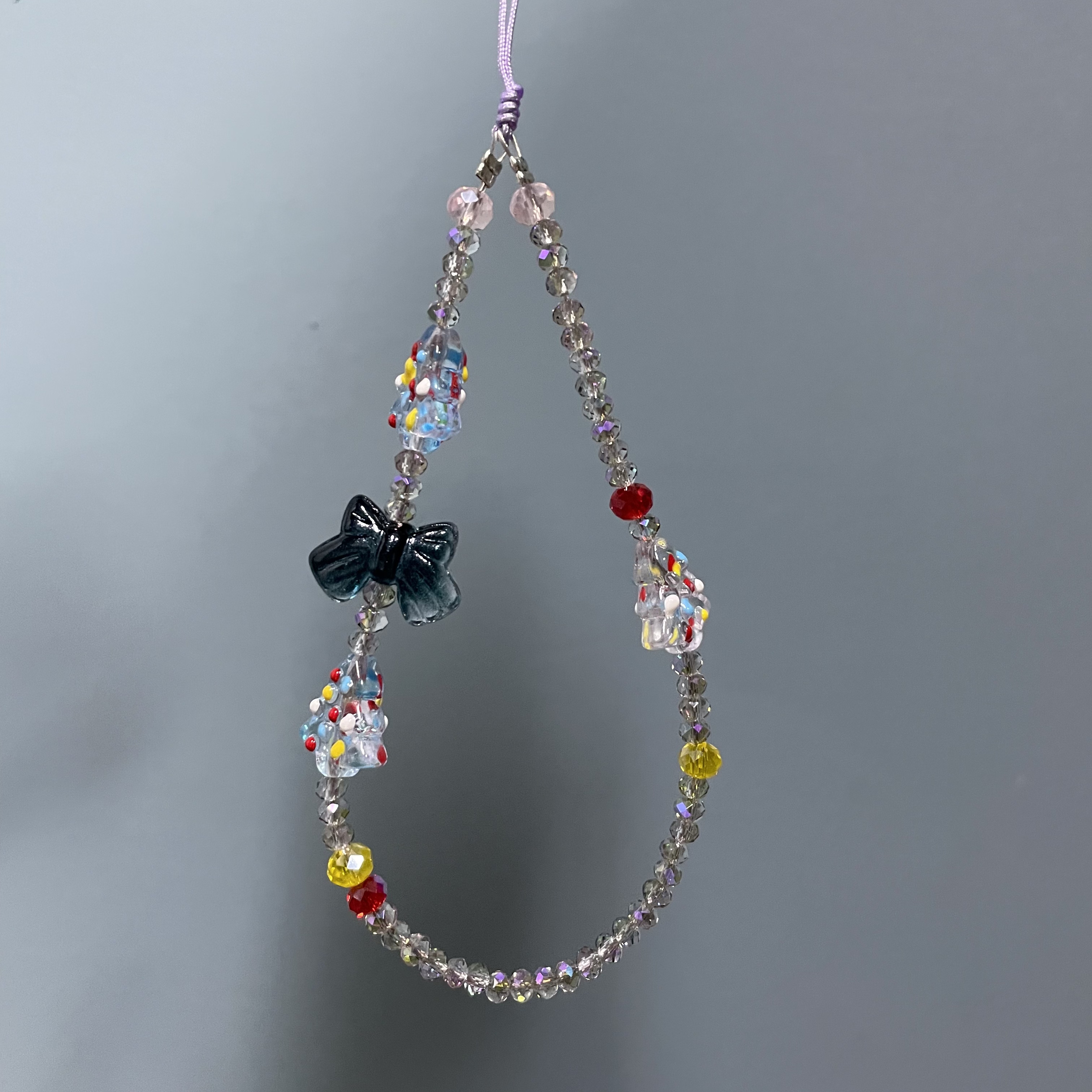 手腕魅影紫色设计款手机链H365