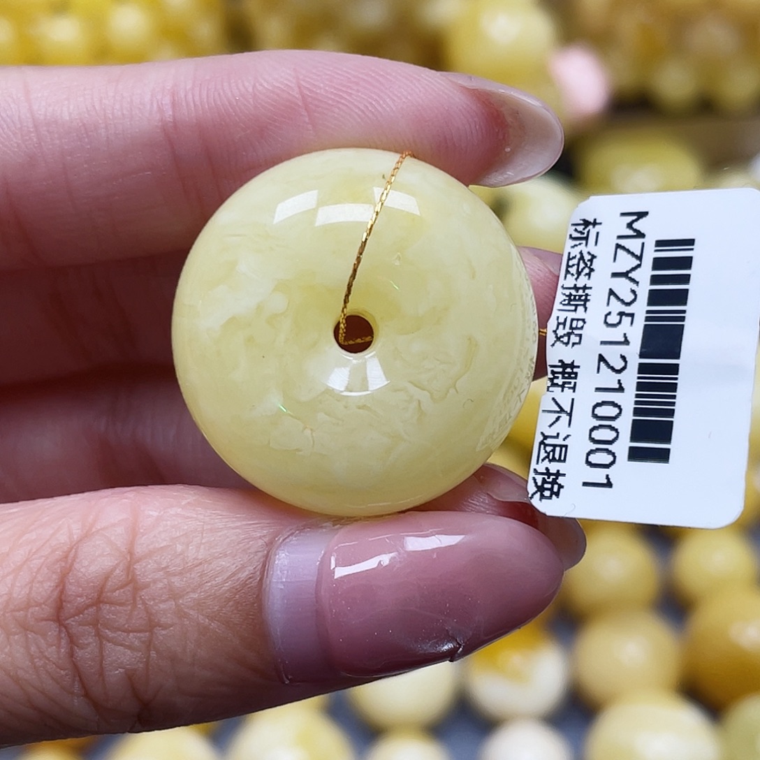 那***年蜜蜡未镶嵌裸石26.4*12.6mm瑕