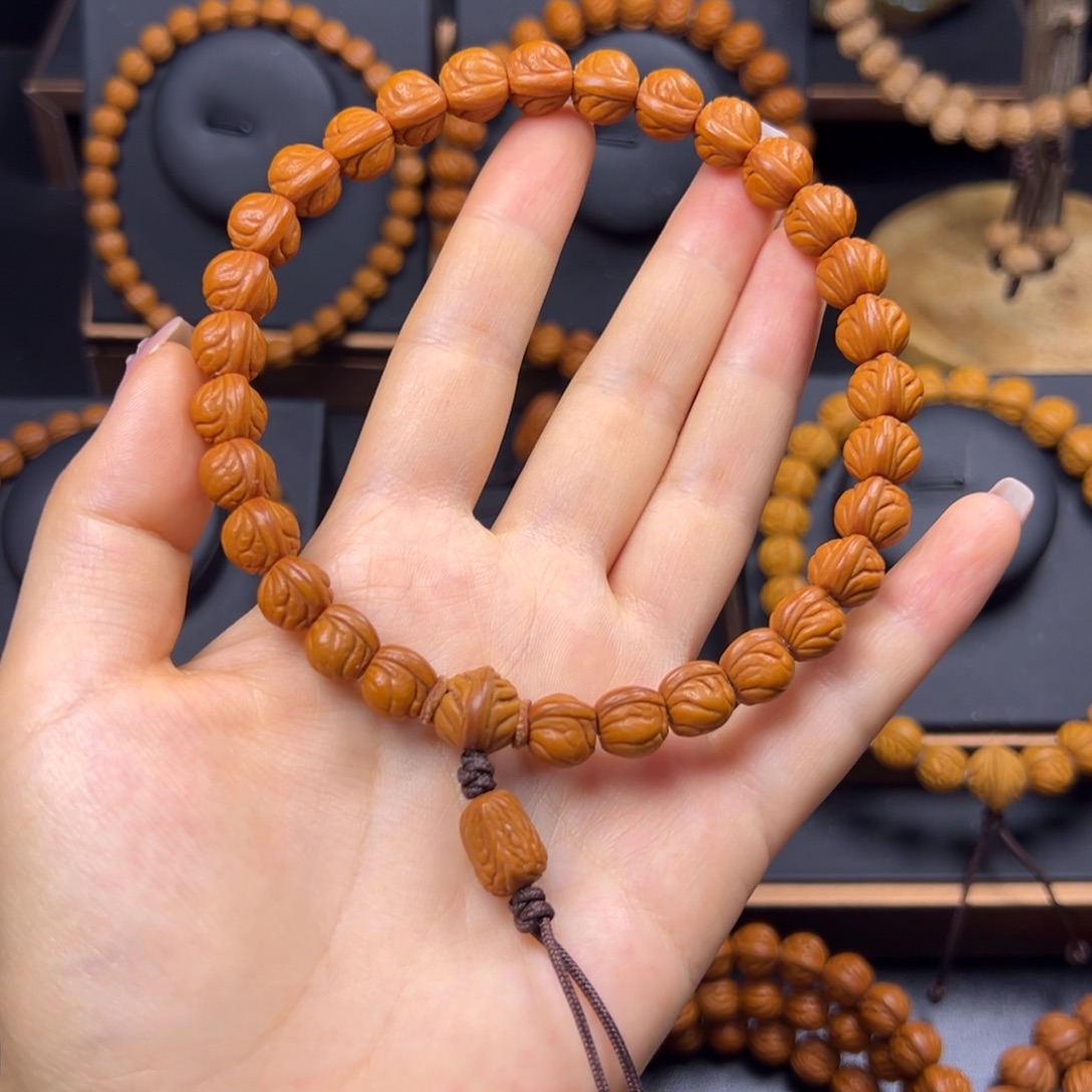 张***乐桃核手串野生玉龙脊10