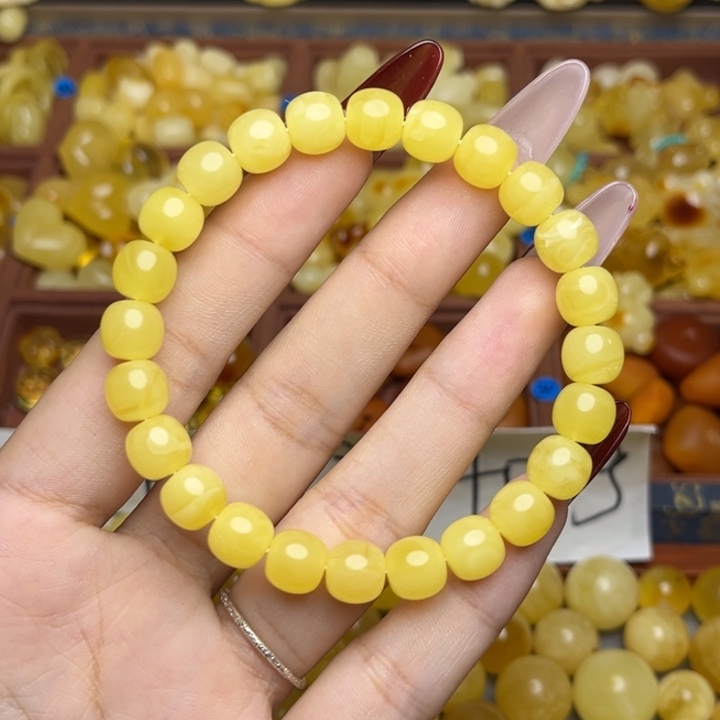 v***n蜜蜡未镶嵌珠宝奇石鸡油黄满蜡妖花老型手串微微瑕