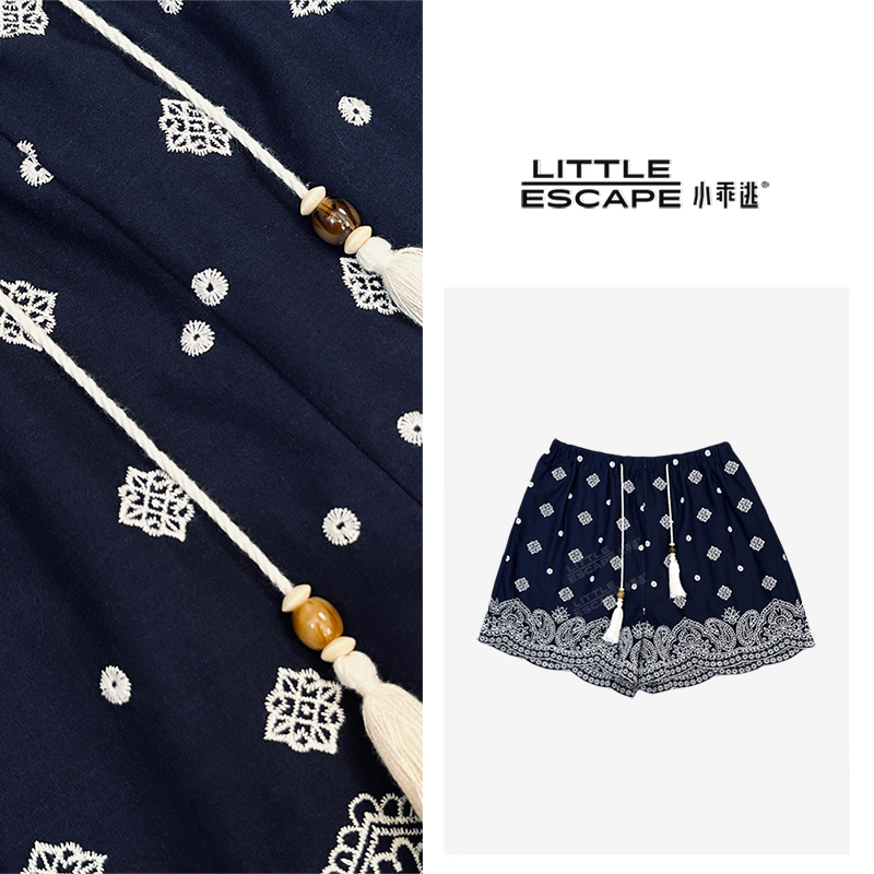 小乖逃藏蓝短裤度假风波浪花边阔腿裤 流苏抽绳吊坠蓝色短裤M8839
