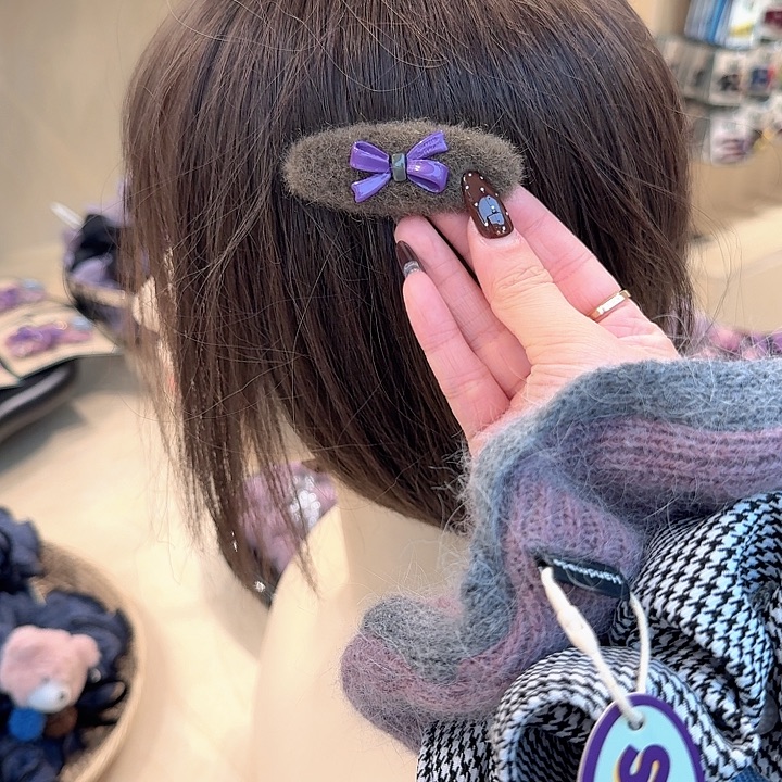 棕色椭圆紫蝴蝶结掰掰