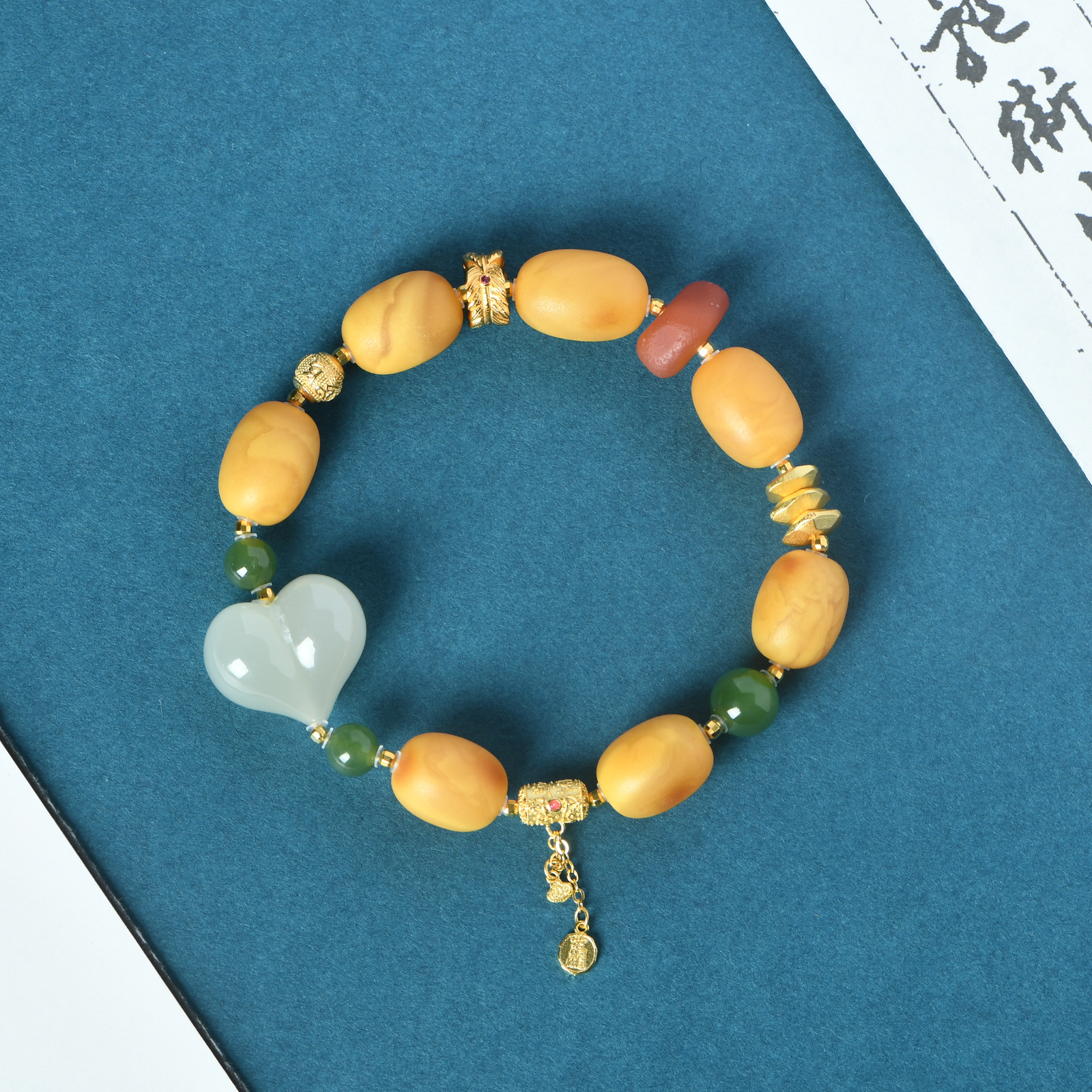 蜜蜡老型藏式多宝手链和田玉净心款