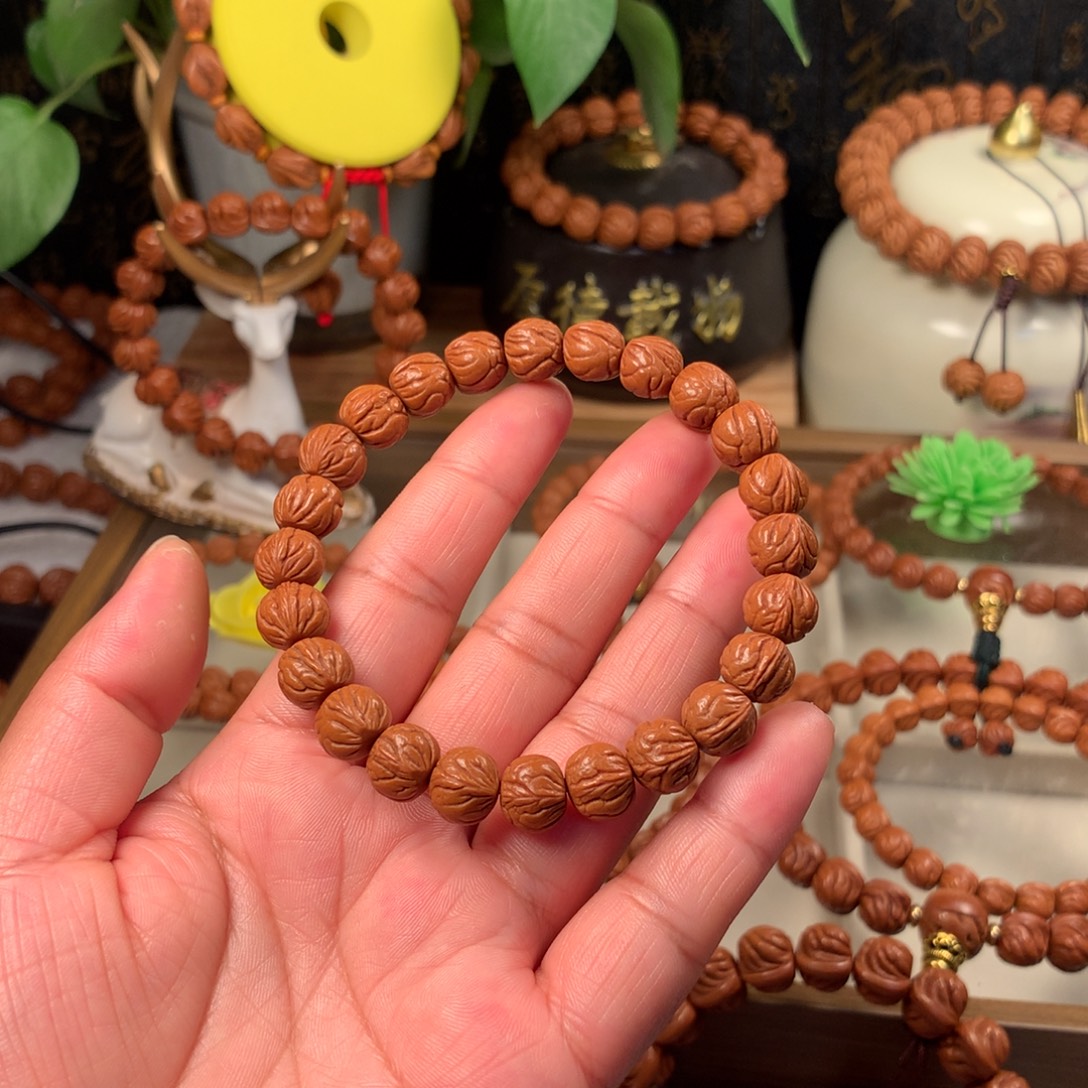 杨***宇桃核吊坠玉龙脊手串10