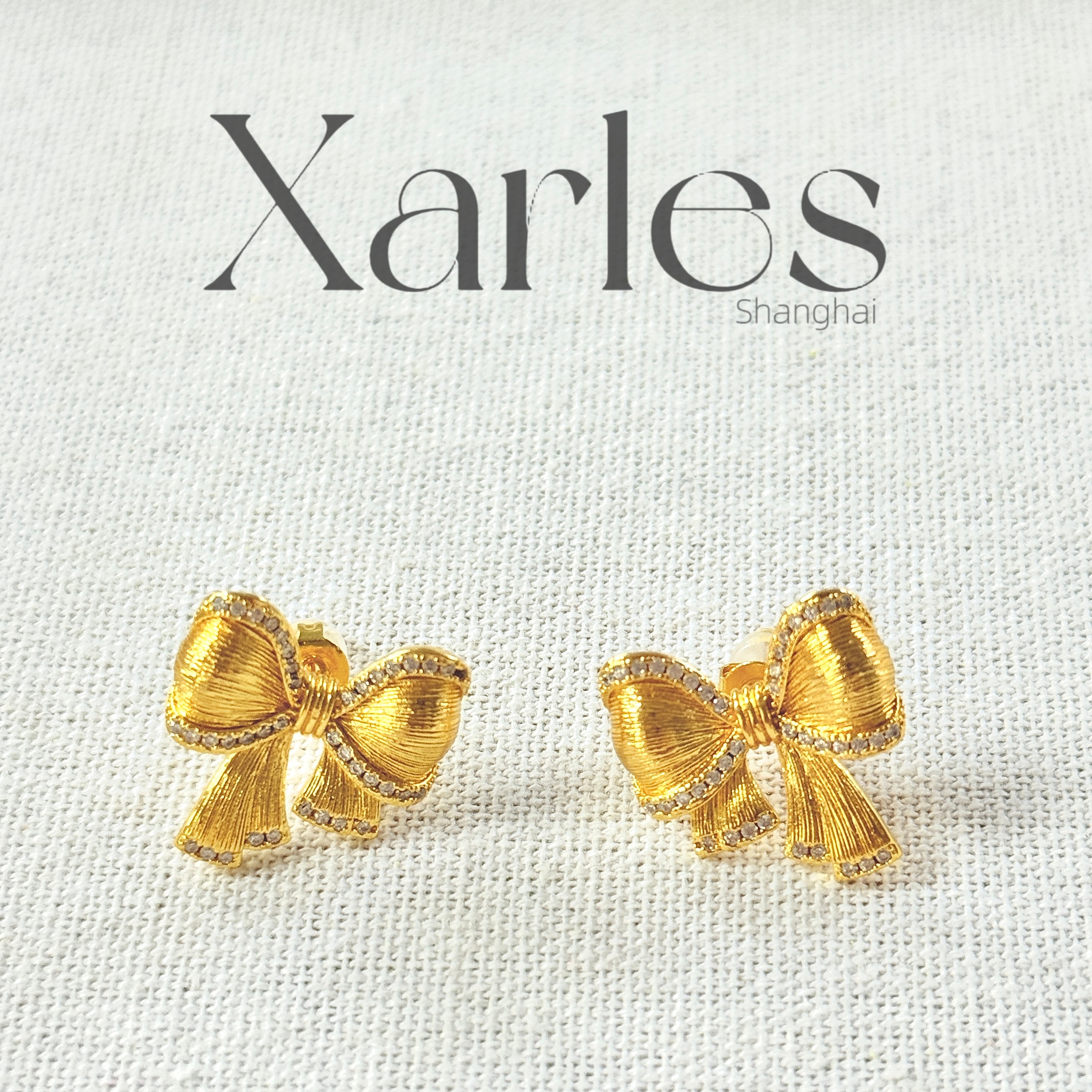 铜合金合成锆石耳饰 蝴蝶结磨砂锆石镶嵌全包围耳环E23514