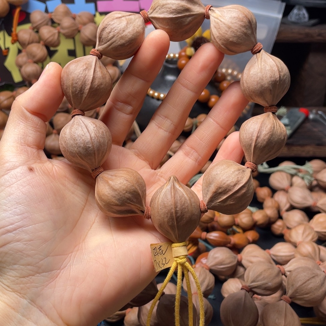 小***光橄榄核吊坠2732四花铁核