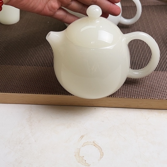 瓷片元**械高档皙白玉瓷龙蛋壶