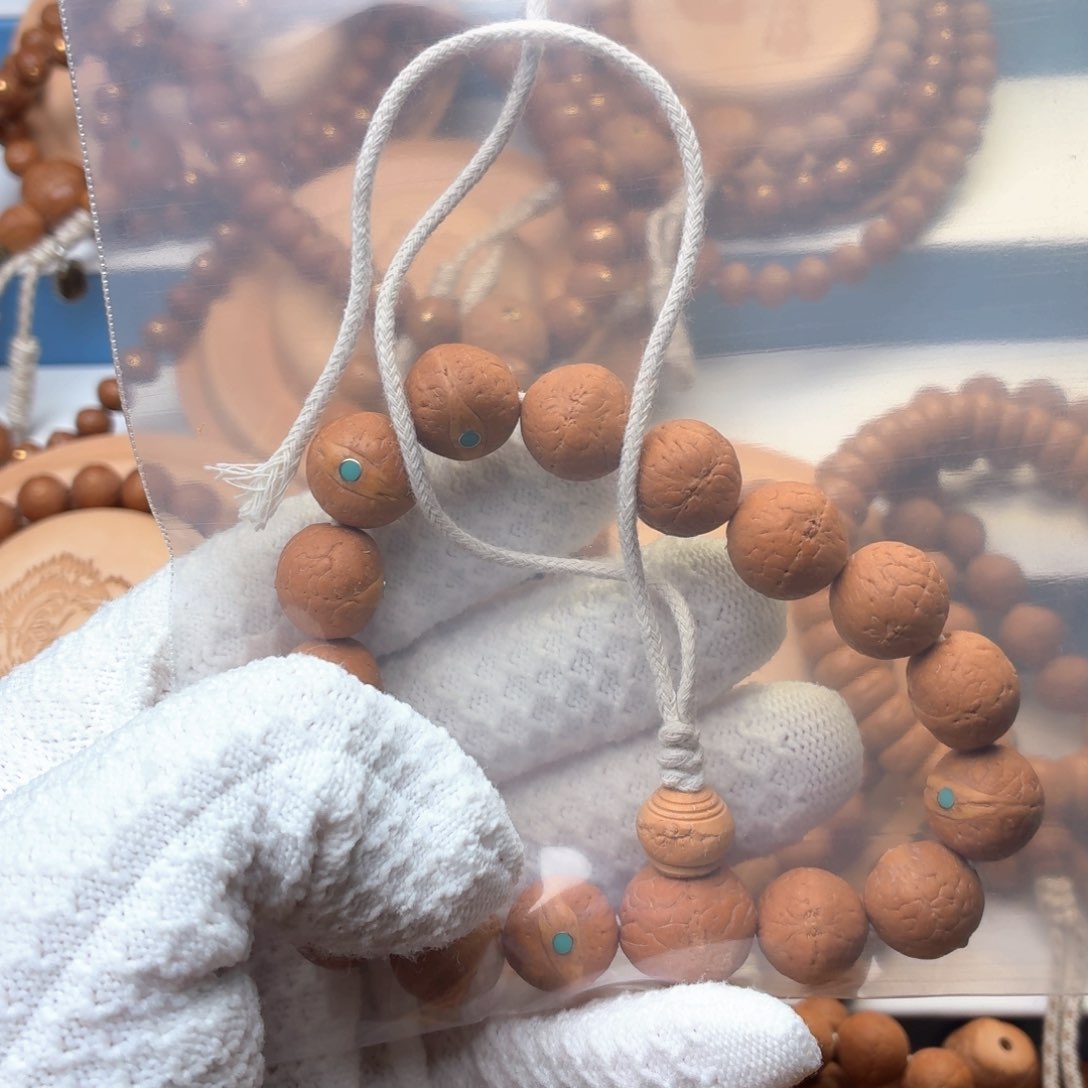 故***里凤眼菩提手串镶嵌